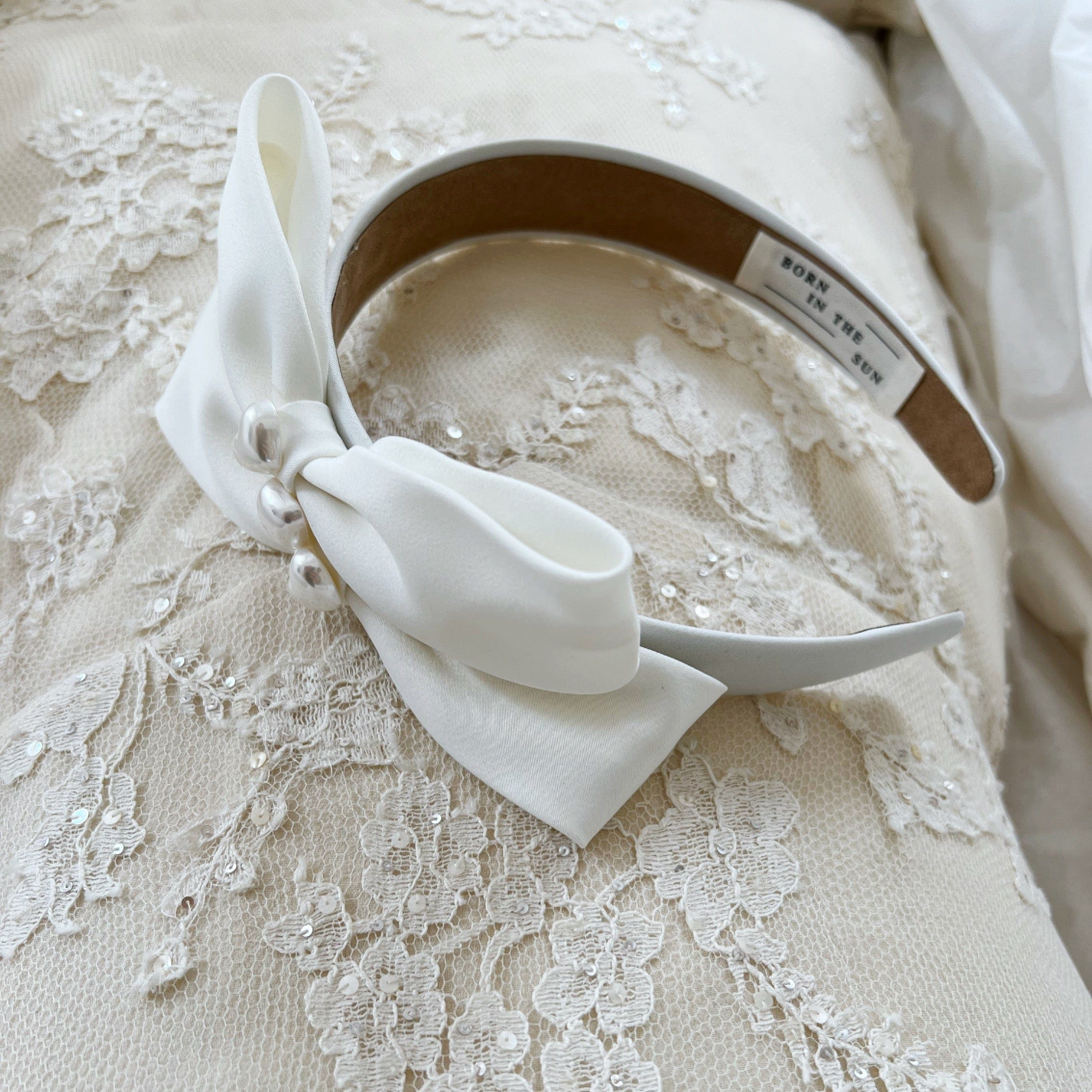 White silk bow ribbon with pearl detail Headband - Born In The Sun